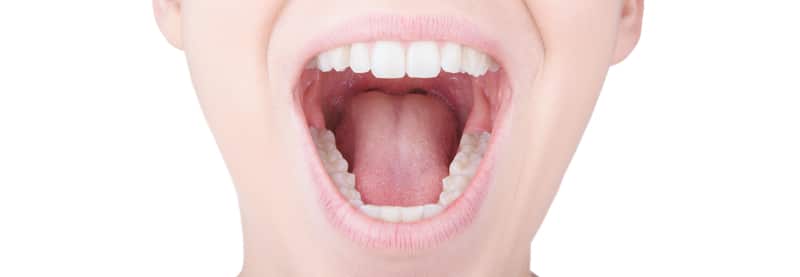 Close-up image of a person opening their mouth