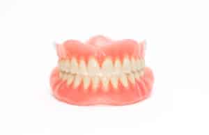 An upper and lower denture mold on a white background.
