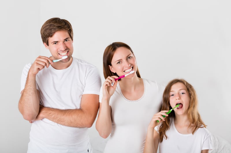 Family Brushing Teeth Together - Dr Ania Mohelicki Site