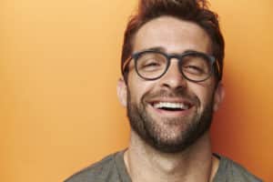 man smiling after dental implants