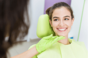 Dentist exam of young teen girl teeth.