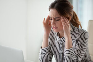 Woman with headache from bite misalignment